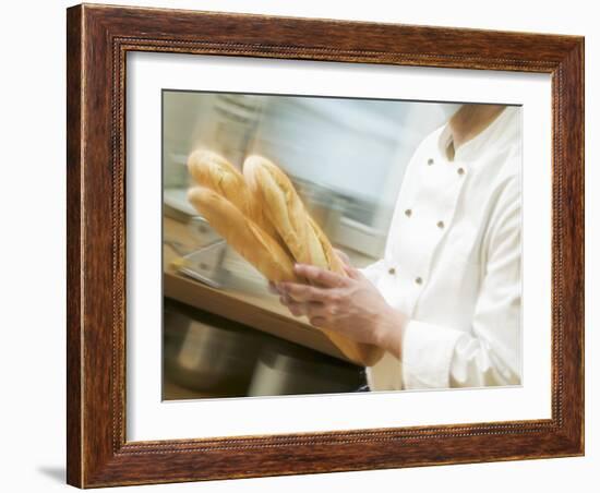 Chef Hurrying Through Kitchen with Baguettes-null-Framed Photographic Print