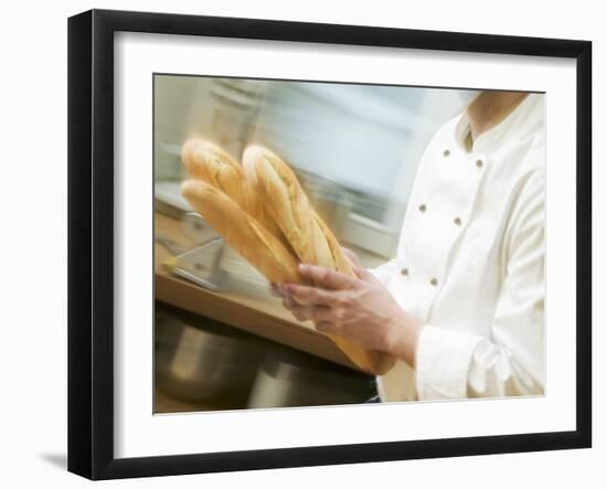 Chef Hurrying Through Kitchen with Baguettes-null-Framed Photographic Print