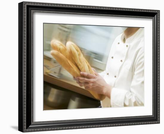 Chef Hurrying Through Kitchen with Baguettes-null-Framed Photographic Print