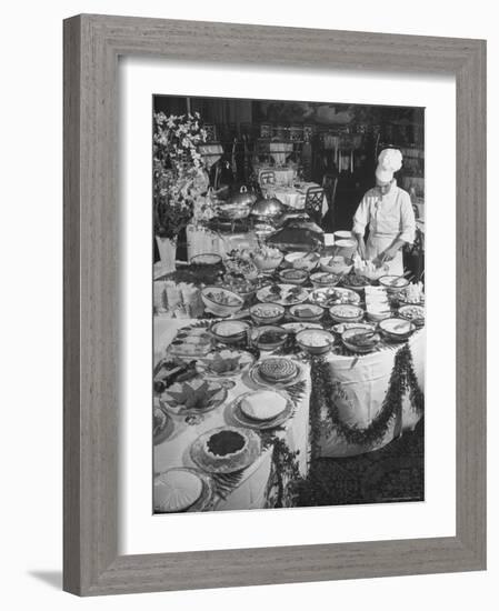 Chef Preparing Dish at Buffet Table in Dining Room of the Waldorf Astoria Hotel-Alfred Eisenstaedt-Framed Photographic Print
