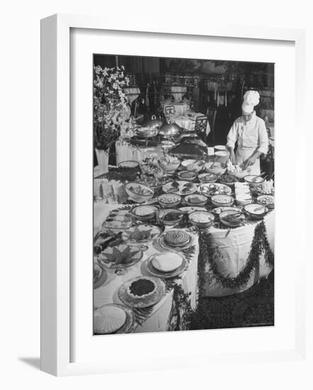 Chef Preparing Dish at Buffet Table in Dining Room of the Waldorf Astoria Hotel-Alfred Eisenstaedt-Framed Photographic Print