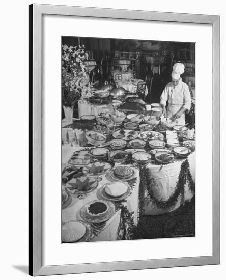 Chef Preparing Dish at Buffet Table in Dining Room of the Waldorf Astoria Hotel-Alfred Eisenstaedt-Framed Photographic Print