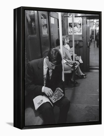 Chess Champion Bobby Fischer Working on His Moves During a Subway Ride-Carl Mydans-Framed Premier Image Canvas