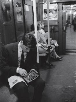 Chess champion Bobby Fischer working on his moves during a subway