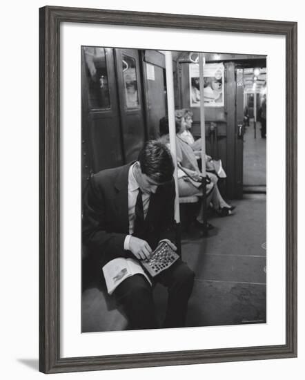 Chess Champion Bobby Fischer Working on His Moves During a Subway Ride-Carl Mydans-Framed Premium Photographic Print