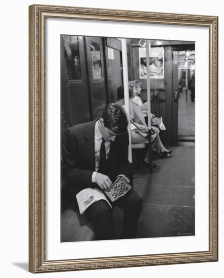 Chess Champion Bobby Fischer Working on His Moves During a Subway Ride-Carl Mydans-Framed Premium Photographic Print