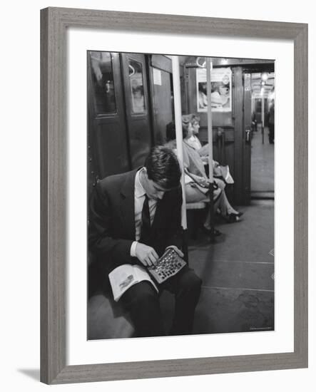 Chess Champion Bobby Fischer Working on His Moves During a Subway Ride-Carl Mydans-Framed Premium Photographic Print