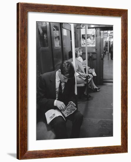 Chess Champion Bobby Fischer Working on His Moves During a Subway Ride-Carl Mydans-Framed Premium Photographic Print