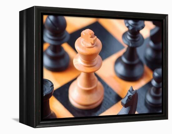 Chess pieces on chessboard-null-Framed Premier Image Canvas