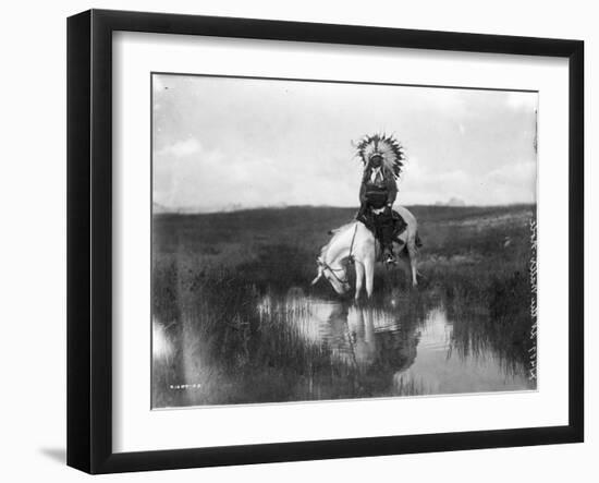 Cheyenne Indian, Wearing Headdress, on Horseback Photograph-Lantern Press-Framed Art Print