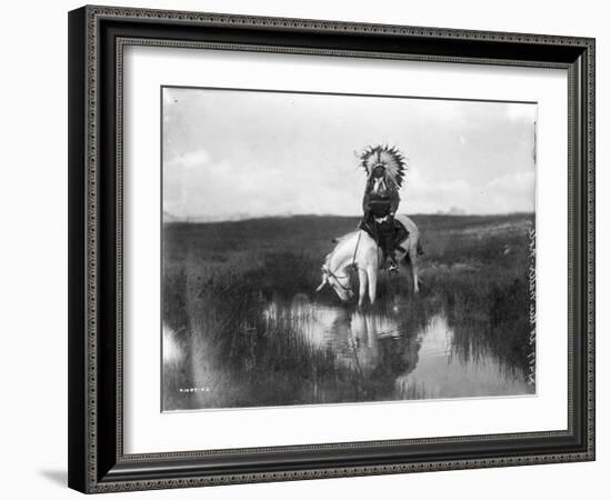 Cheyenne Indian, Wearing Headdress, on Horseback Photograph-Lantern Press-Framed Art Print