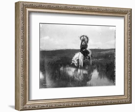 Cheyenne Indian, Wearing Headdress, on Horseback Photograph-Lantern Press-Framed Art Print