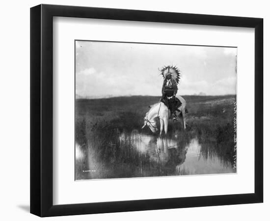 Cheyenne Indian, Wearing Headdress, on Horseback Photograph-Lantern Press-Framed Art Print