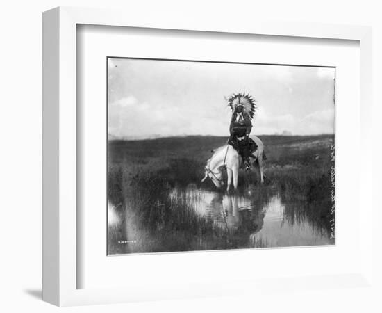 Cheyenne Indian, Wearing Headdress, on Horseback Photograph-Lantern Press-Framed Art Print