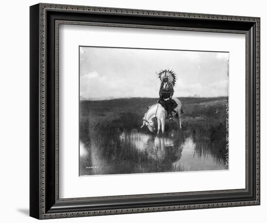 Cheyenne Indian, Wearing Headdress, on Horseback Photograph-Lantern Press-Framed Art Print