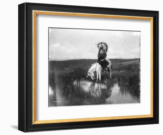 Cheyenne Indian, Wearing Headdress, on Horseback Photograph-Lantern Press-Framed Art Print