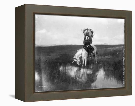 Cheyenne Indian, Wearing Headdress, on Horseback Photograph-Lantern Press-Framed Stretched Canvas