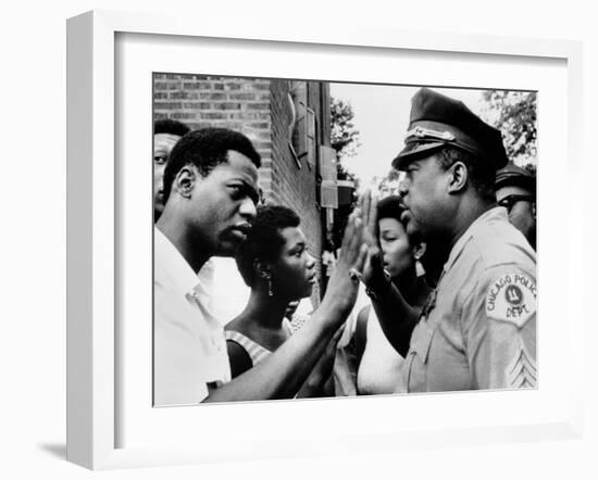 Chicago African American Policeman Tries to Calm a Crowd-null-Framed Photo