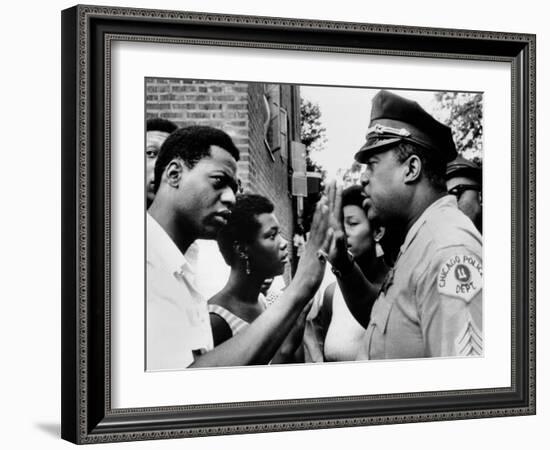 Chicago African American Policeman Tries to Calm a Crowd-null-Framed Photo