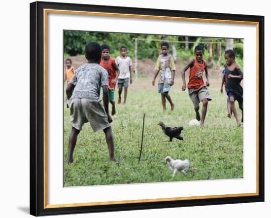 Chickens Run to Avoid a Soccer Game Played by Children from Lolovoli Village on the Island of Ambae-null-Framed Photographic Print