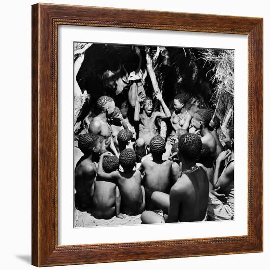 Chief Acts Out a Story to Bushman Children, Southern Kalahari Desert in Central Southern Africa-Nat Farbman-Framed Photographic Print