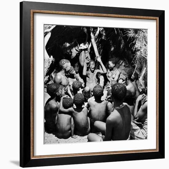 Chief Acts Out a Story to Bushman Children, Southern Kalahari Desert in Central Southern Africa-Nat Farbman-Framed Photographic Print