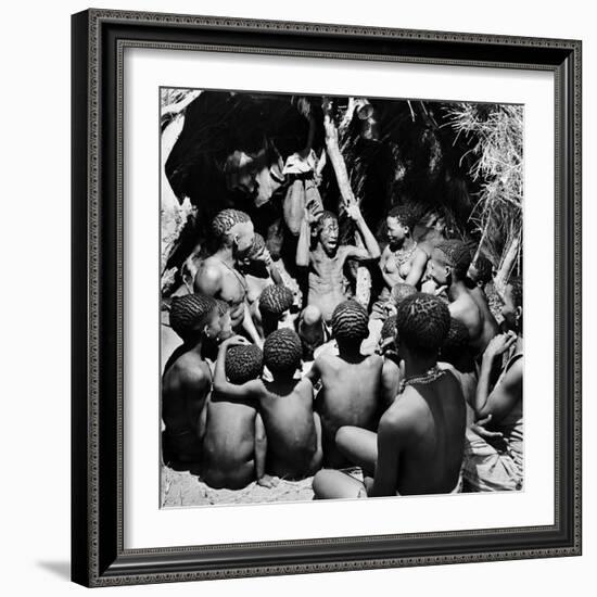 Chief Acts Out a Story to Bushman Children, Southern Kalahari Desert in Central Southern Africa-Nat Farbman-Framed Photographic Print