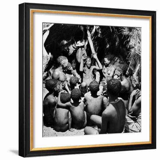 Chief Acts Out a Story to Bushman Children, Southern Kalahari Desert in Central Southern Africa-Nat Farbman-Framed Photographic Print