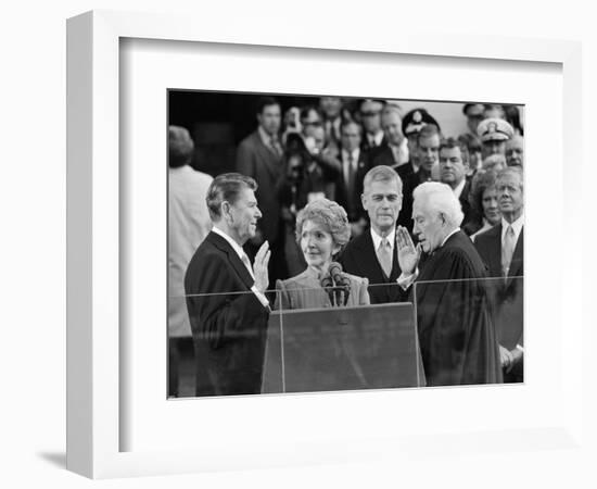 Chief Justice Warren Burger Administers the Oath of Office to Ronald Reagan, January 20, 1981-null-Framed Premium Photographic Print