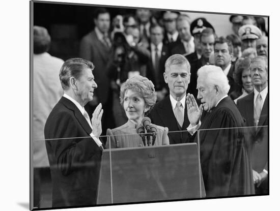 Chief Justice Warren Burger Administers the Oath of Office to Ronald Reagan, January 20, 1981-null-Mounted Photographic Print