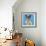 Chihuahua, 16 Months Old, Sitting In Front Of Blue Background With Easter Basket-Life on White-Framed Photographic Print displayed on a wall