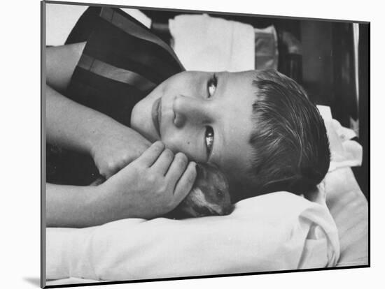 Child Cuddling with a Hamster as Part of a Method of Using Therapy Through Animals-Francis Miller-Mounted Photographic Print