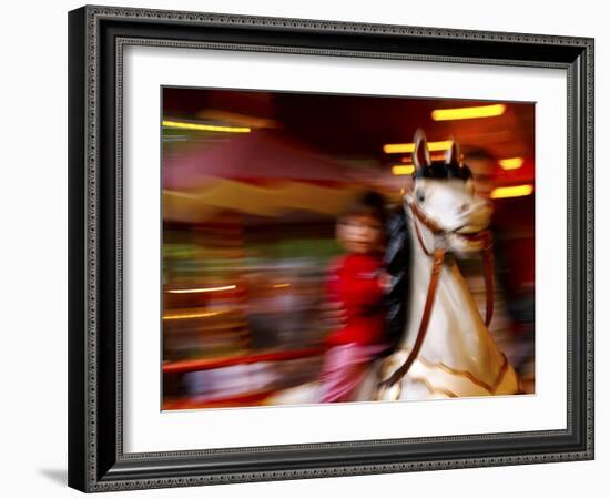 Child on Carousel at Grona Lund Amusement Park, Stockholm, Sweden-Nancy & Steve Ross-Framed Photographic Print