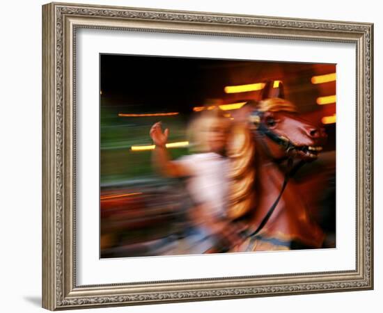 Child on Carousel at Grona Lund Amusement Park, Stockholm, Sweden-Nancy & Steve Ross-Framed Photographic Print