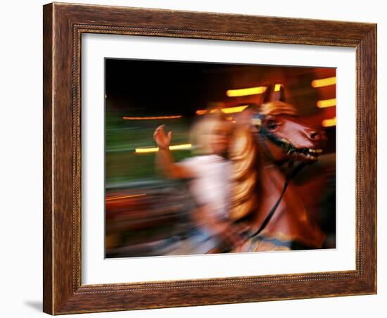 Child on Carousel at Grona Lund Amusement Park, Stockholm, Sweden-Nancy & Steve Ross-Framed Photographic Print