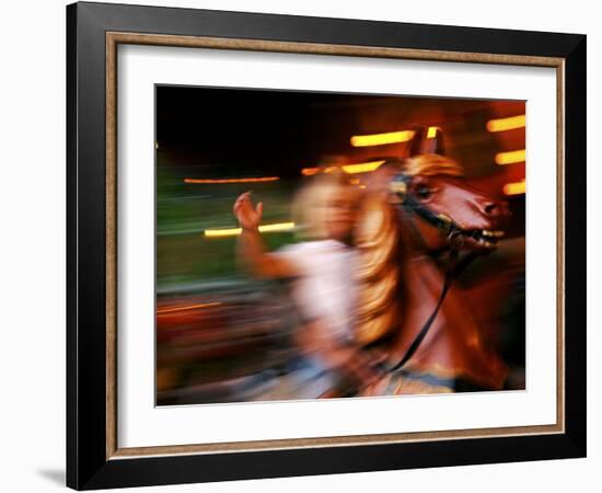 Child on Carousel at Grona Lund Amusement Park, Stockholm, Sweden-Nancy & Steve Ross-Framed Photographic Print