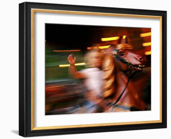 Child on Carousel at Grona Lund Amusement Park, Stockholm, Sweden-Nancy & Steve Ross-Framed Photographic Print