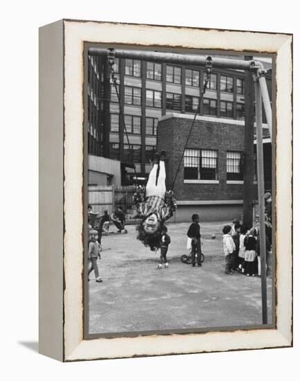 Child on Swings in Playground at the KLH Day Care Center-Leonard Mccombe-Framed Premier Image Canvas