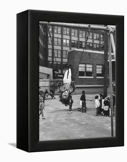 Child on Swings in Playground at the KLH Day Care Center-Leonard Mccombe-Framed Premier Image Canvas
