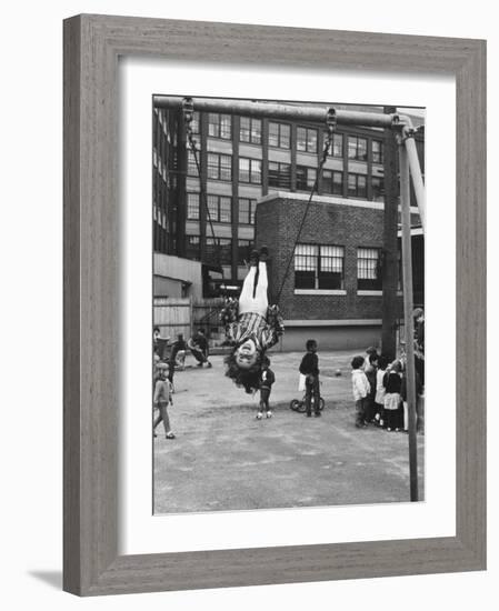 Child on Swings in Playground at the KLH Day Care Center-Leonard Mccombe-Framed Photographic Print