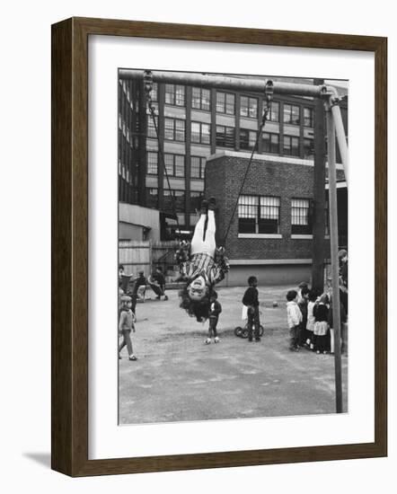 Child on Swings in Playground at the KLH Day Care Center-Leonard Mccombe-Framed Photographic Print