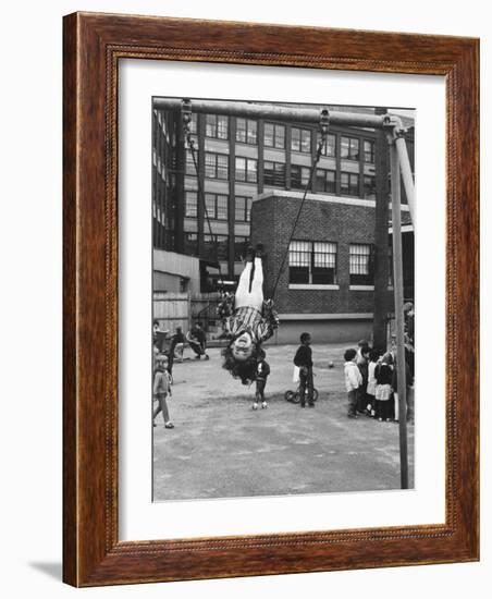 Child on Swings in Playground at the KLH Day Care Center-Leonard Mccombe-Framed Photographic Print