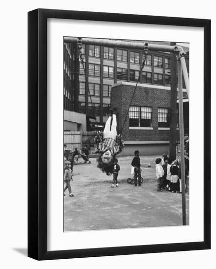 Child on Swings in Playground at the KLH Day Care Center-Leonard Mccombe-Framed Photographic Print