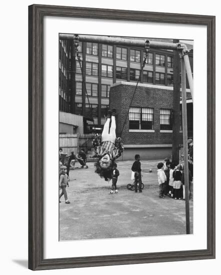 Child on Swings in Playground at the KLH Day Care Center-Leonard Mccombe-Framed Photographic Print