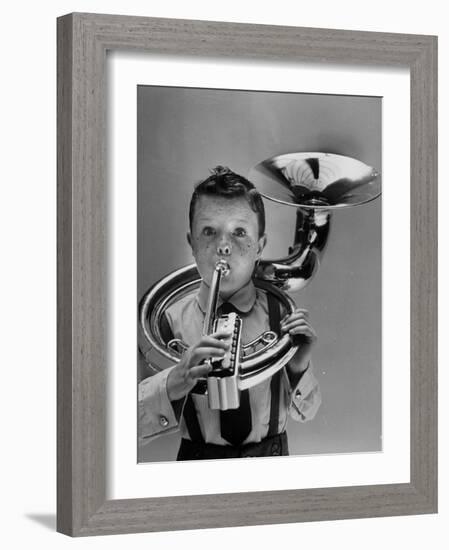 Child Playing Musical Instrument-Nina Leen-Framed Photographic Print