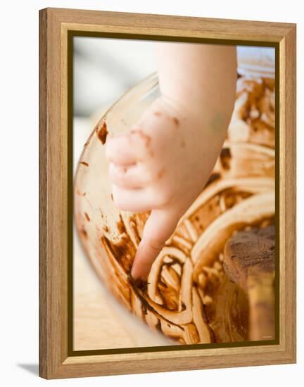 Child's Hand Scraping Mixing Bowl-Greg Elms-Framed Premier Image Canvas