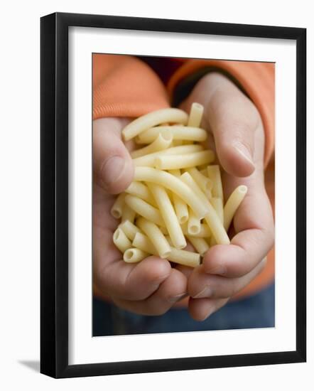 Child's Hands Holding Macaroni-null-Framed Photographic Print