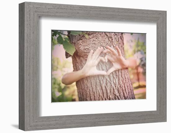 Child's Hands Making a Heart Shape on a Tree Trunk. Instagram Effect-soupstock-Framed Photographic Print