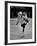 Child Skater Helen Ann Rousselle Holding Doll While Skating across the Ice-null-Framed Photographic Print