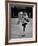 Child Skater Helen Ann Rousselle Holding Doll While Skating across the Ice-null-Framed Photographic Print